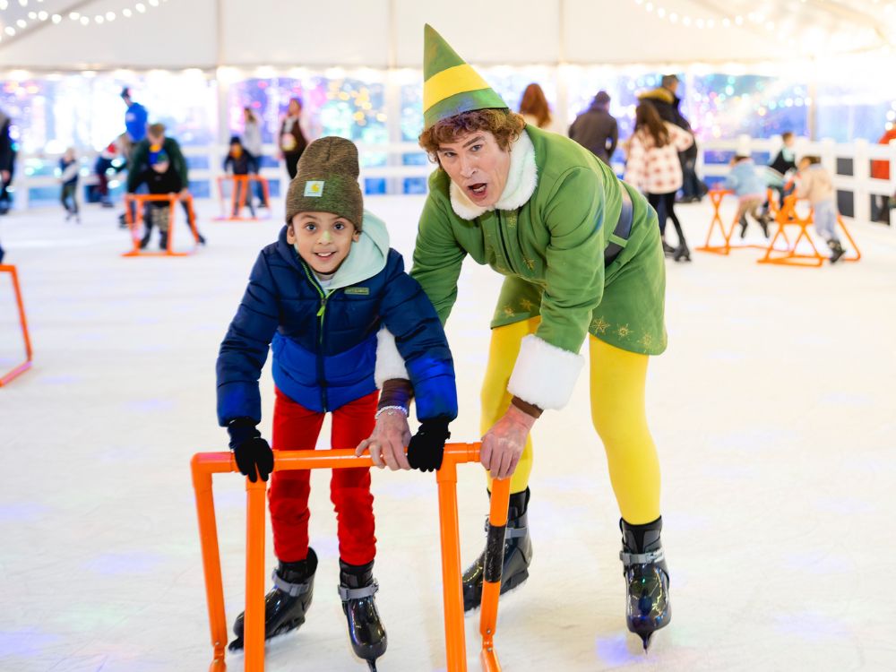 A family hand-in-hand, enjoying the ice rink, skating outside on the real ice.