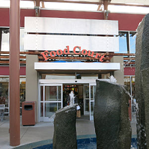 Seattle Premium Outlets Food Court Quil Ceda Village - find food options like Cafe Bento, Poke Pekoe, Famous Wok, Indian Food Truck, and Qdoba Mexican Eats.